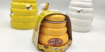 Barattolo per miele in ceramica con spargimiele di legno